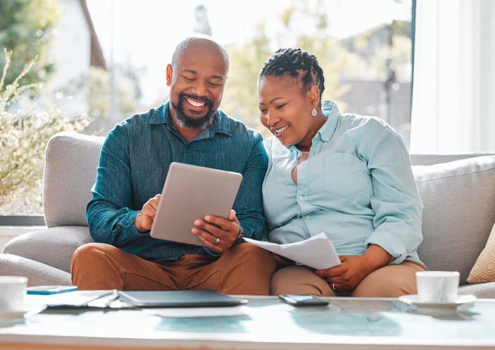 homeowners comfortably reviewing documents at home homeowners comfortably reviewing documents at home
